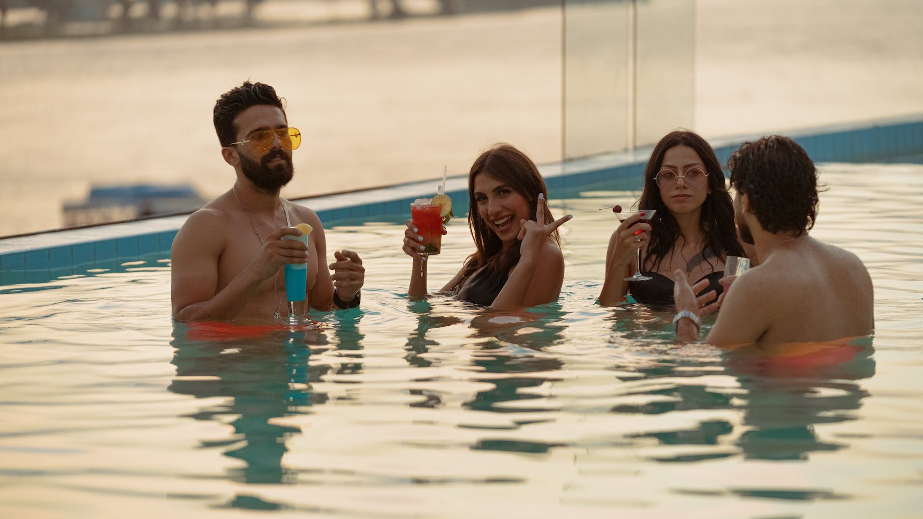 a group of friends having a pool party